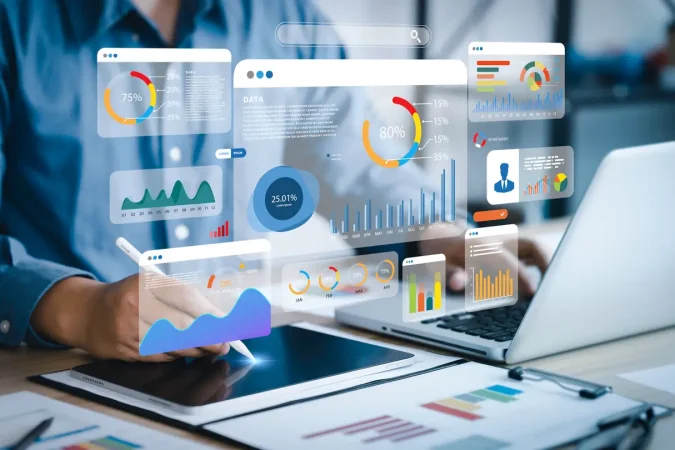 An analyst uses a computer and dashboard for data business analysis and Data Management System with KPI and metrics connected to the database for technology finance, operations, sales, marketing